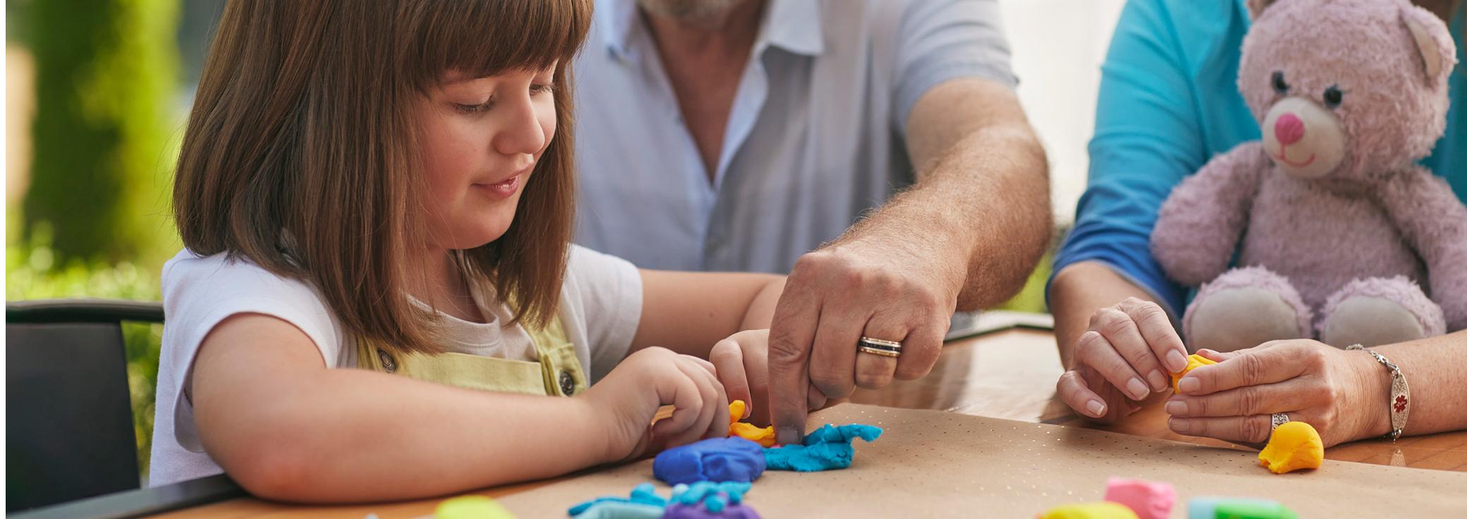 Ellamee, living with LGS, playing with clay