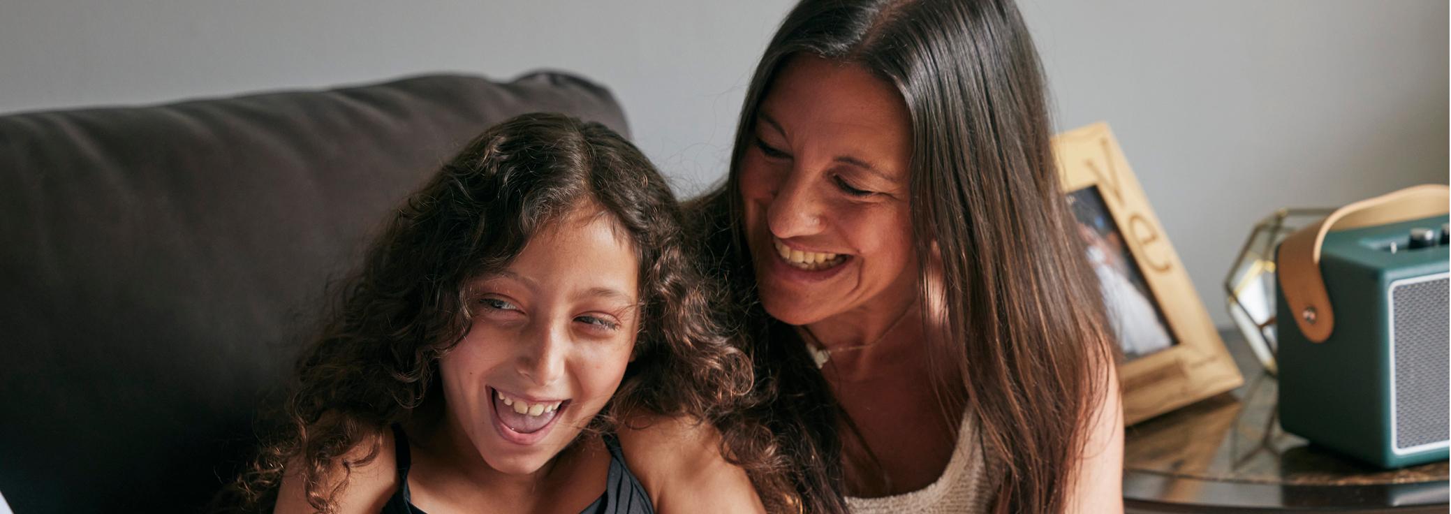 Markella, living with Dravet syndrome, laughing with her mother